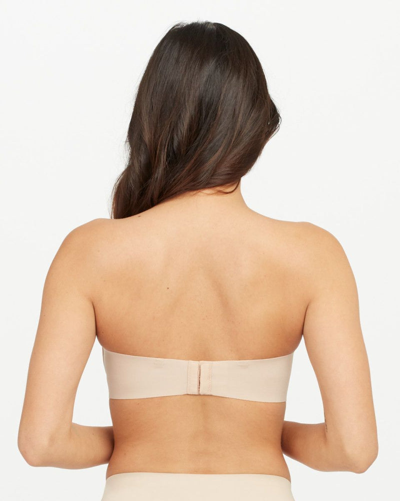 SPANX - Just like our Up For Anything Strapless Bra, this Better Bandeau  stays put! 🙌❤️ The light padding in the bra gives your girls shape so they  look great from all